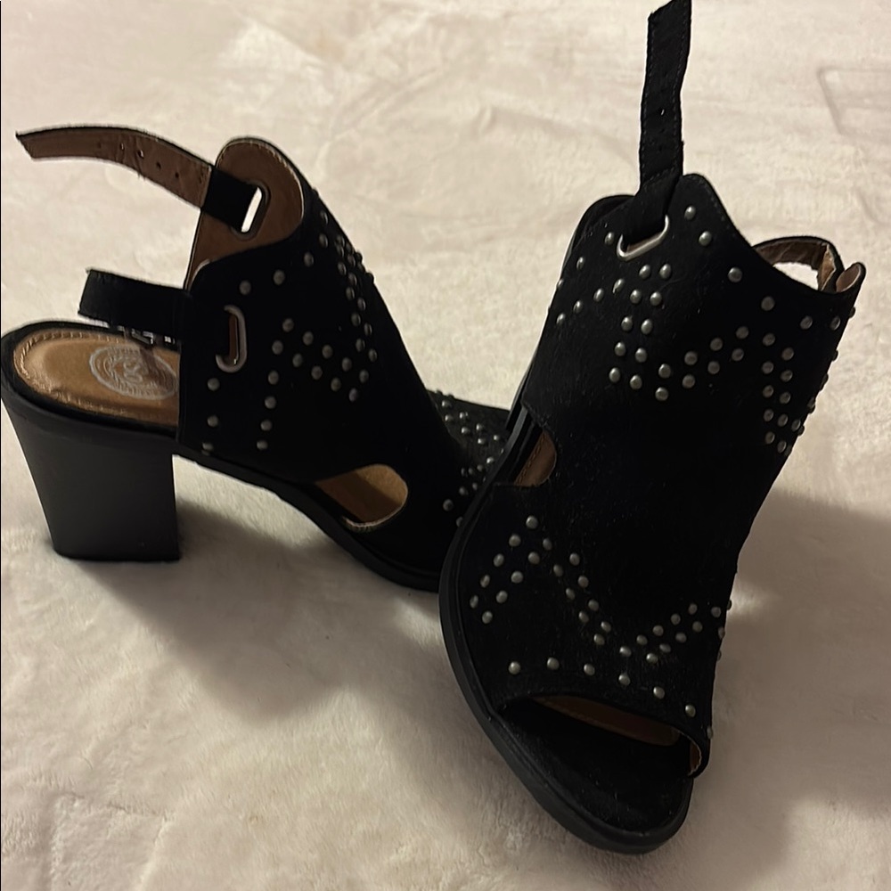 Black Heeled Boots with Decorative Cutouts